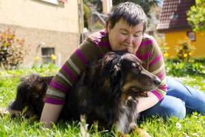 woman playing with a dog