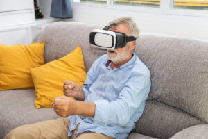 older gentleman using a virtual reality headset