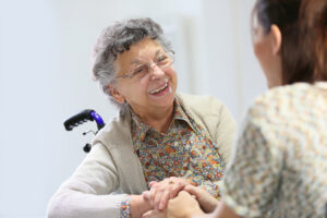 two women discussing care in a nursing home