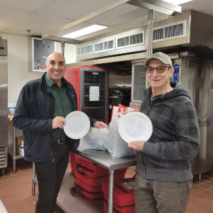 Gloucester Mayor Greg Verga and volunteer Vito LaMura prepare to deliver Meals on Wheels